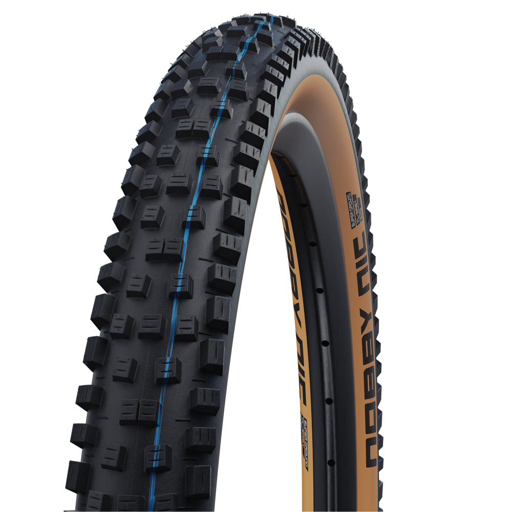 SCHWALBE NOBBY NIC 27.5x2.40 ADDIX SPEEDGRIP SUPERGROUND Snakeskin Tubeless Ready Zacht Zwart/Bruin band